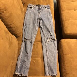 Light blue ripped jeans